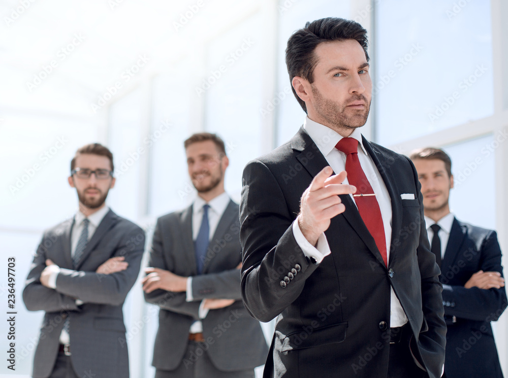 serious businessman standing in the office serious businessman standing in the office