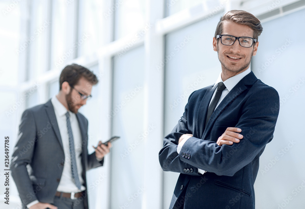 successful businessman on the background of the office successful businessman on the background of the office