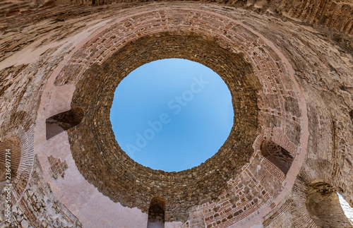 An open antique round roof of a building.