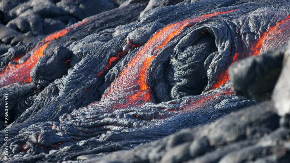Volcanic red hot lava pouring into the Pacific ocean from Kilauea seen before dawn Hawaii USA 