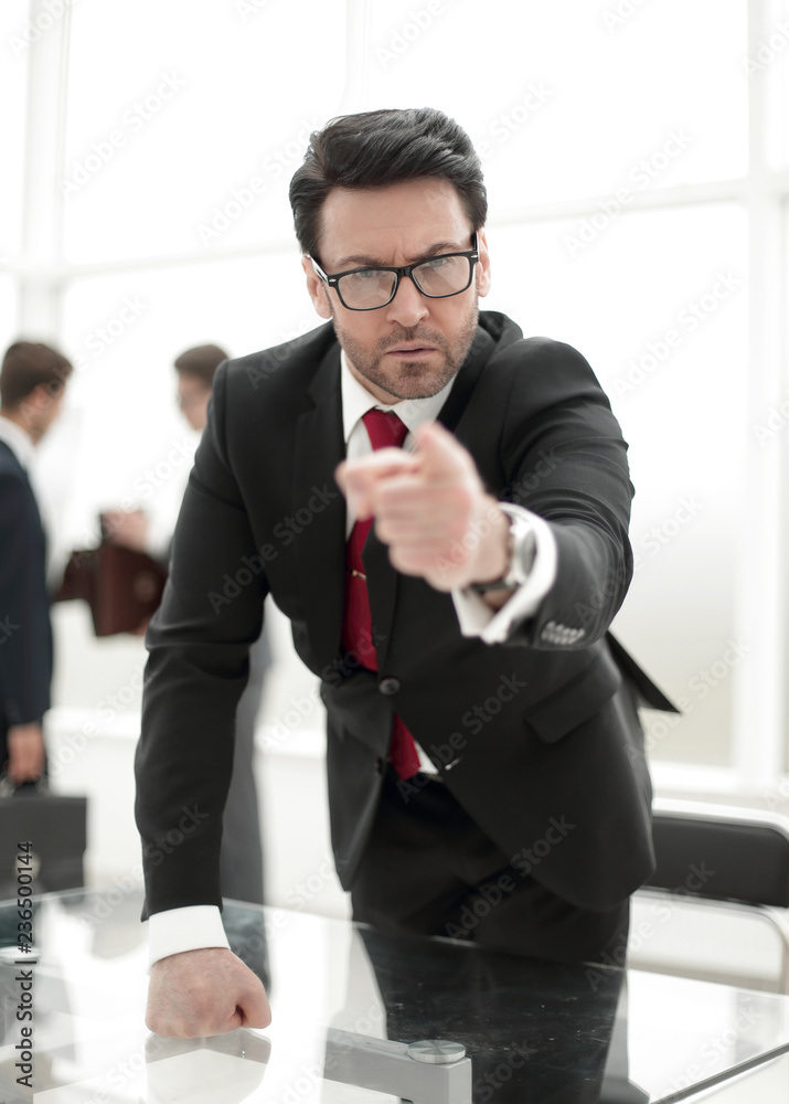 strict business owner pointing finger at you. strict business owner pointing finger at you.