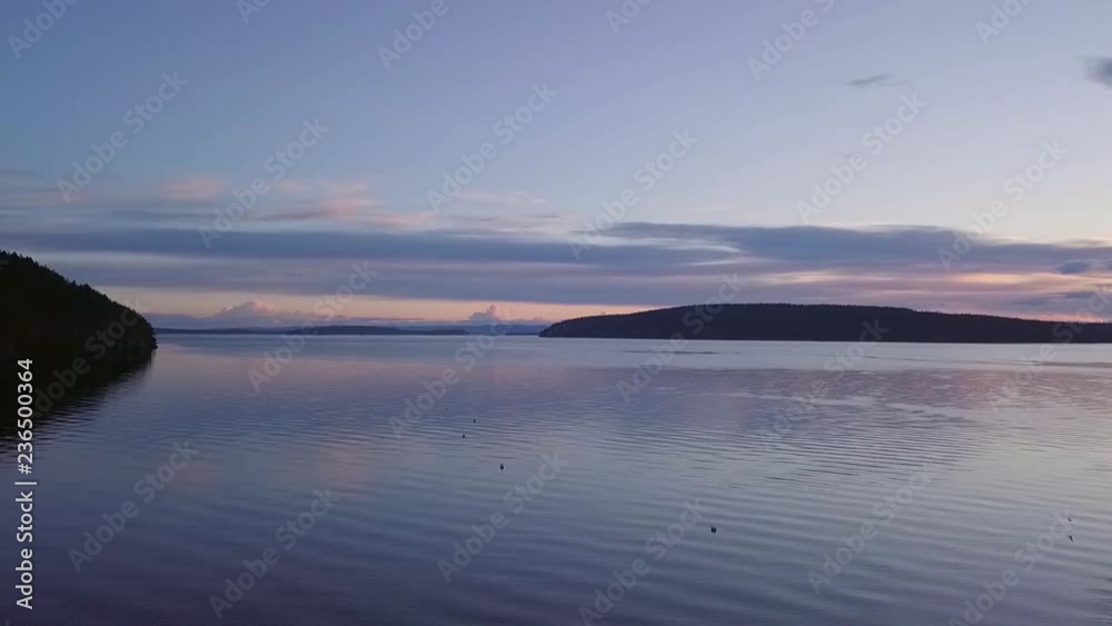 Sunset hue reflections at the San Juan Islands. Sunset hue reflections at the San Juan Islands.