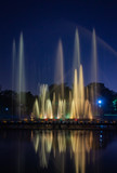 musical Water fountains in night beautifully curved long exposure