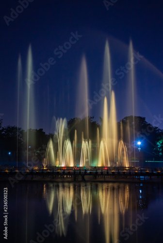 musical Water fountains in night beautifully curved long exposure