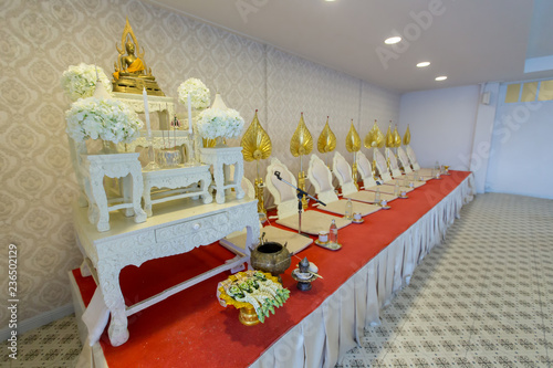 Monk seats for monk when making merit, chanting or praying or meditating in traditional buddhism ceremony,. Engagement design with decoration and object in cultural in Thai wedding traditional room. photo