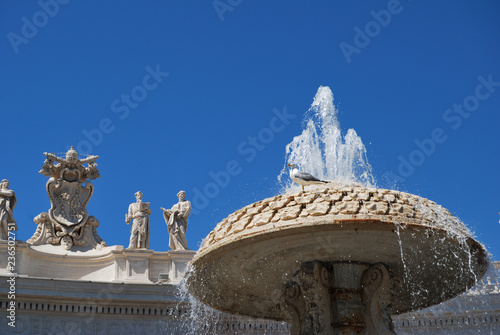 View of a fountain and the Basilica of Saint Peter in Vatican City - ROME, ITALY