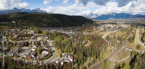 Aerial panoramic view of Residential homes in a small alpine town during a cloudy day. Taken in Jasper, Alberta, Canada.