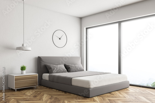 White loft bedroom corner with clock © ImageFlow