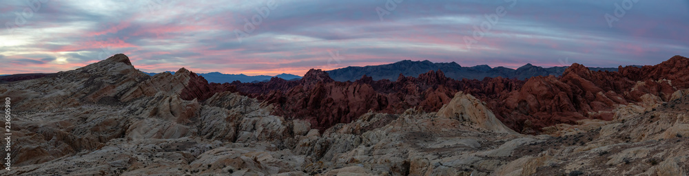 Beautiful panoramic American Landscape during a cloudy sunrise. Taken in Valley of Fire State Park, Nevada, United States.