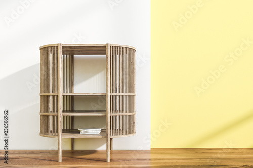 Bookcase in white and yellow room photo