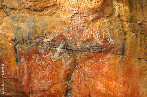 Aboriginal Rock Art of people dancing at Kakadu National Park, Northern Territory, Australia. photo