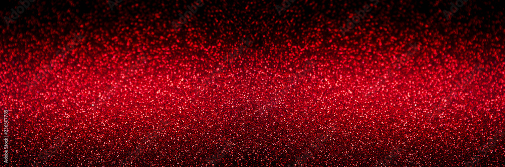 festive Red abstract blurred glitter background,