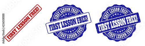 FIRST LESSON FREE! scratched stamp seals in red and blue colors. Vector FIRST LESSON FREE! labels with grainy texture. Graphic elements are rounded rectangles, rosettes, circles and text labels.