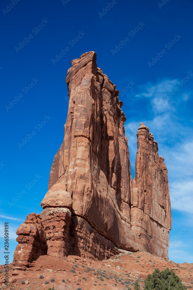 Landscape view of beautiful red rock canyon formations during a vibrant sunny day. Taken in Arches National Park, located near Moab, Utah, United States.