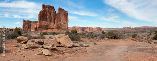Panoramic landscape view of beautiful red rock canyon formations during a vibrant sunny day. Taken in Arches National Park, located near Moab, Utah, United States. © edb3_16