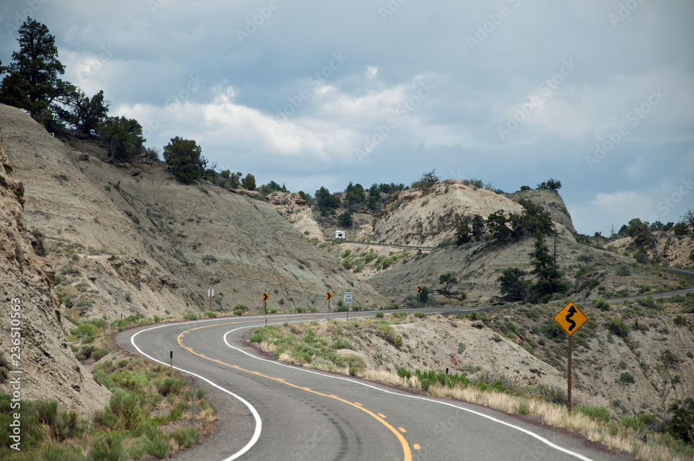Curved road with traffic sign 