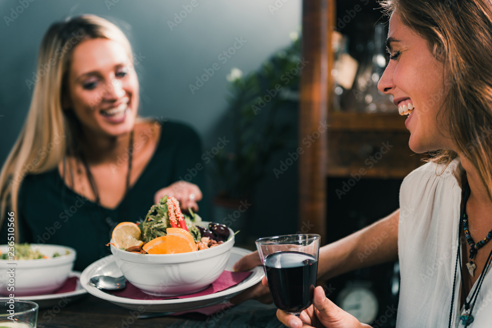 Vegetarian Restaurant. Cheerful Female Friends Rejoicing At Fresh Salad.