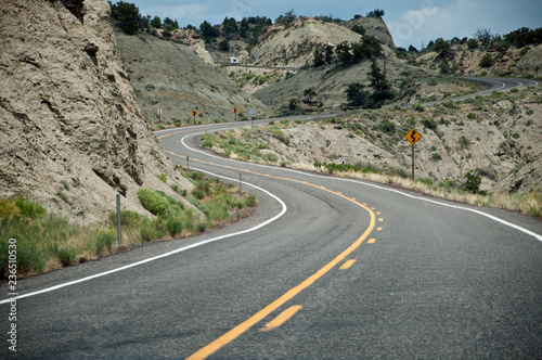 Curved road uphill in desert, USA