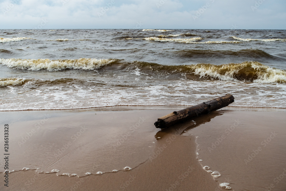 storm clouds forming over clear sea beach with rocks and clear sand storm clouds forming over clear sea beach with rocks and clear sand