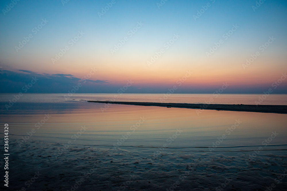 Obraz premium calm blue sunset over clear water in baltic sea