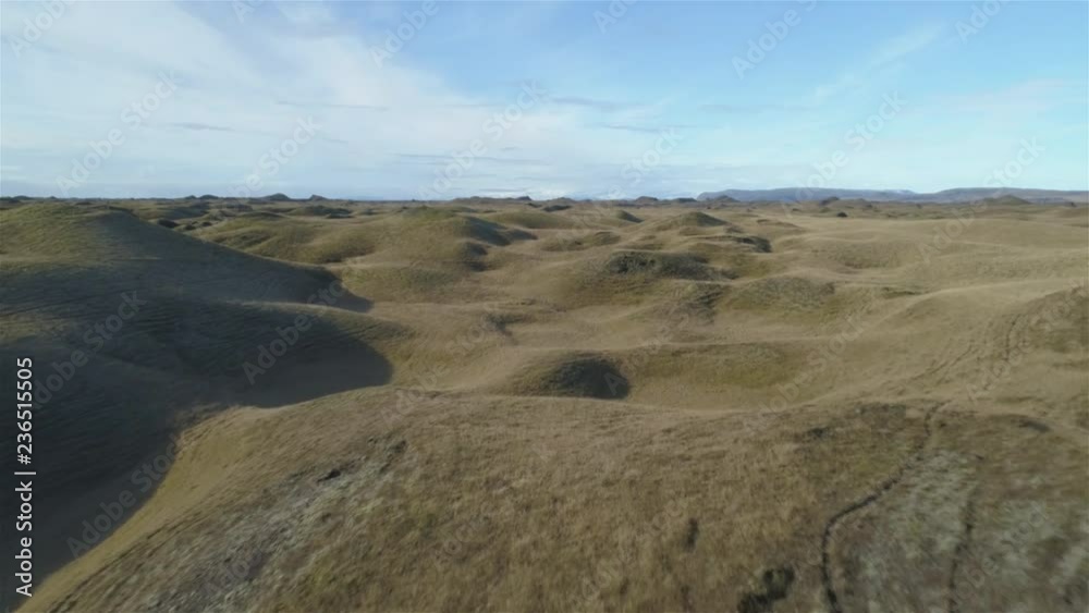 Drone aerial revealing shot over undulating glacial terrain, Kirkubaerklaustur Iceland.mov Drone aerial revealing shot over undulating glacial terrain, Kirkubaerklaustur Iceland.mov