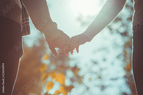 Sweet couple holding hands in the park