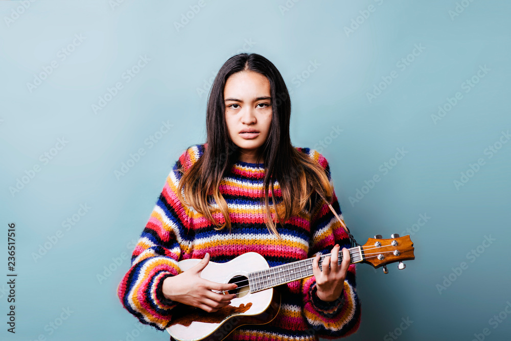 Young teen upset with learning curve of ukulele Young teen upset with learning curve of ukulele