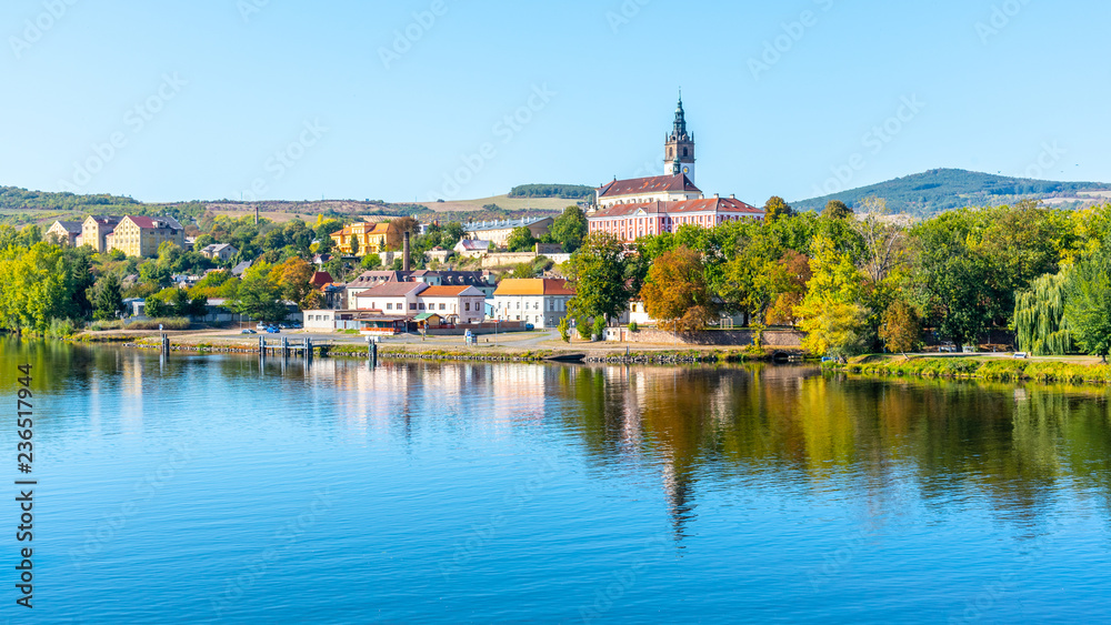 Panoramic cityscape of Litomerice reflected in Labe River, Czech Republic.