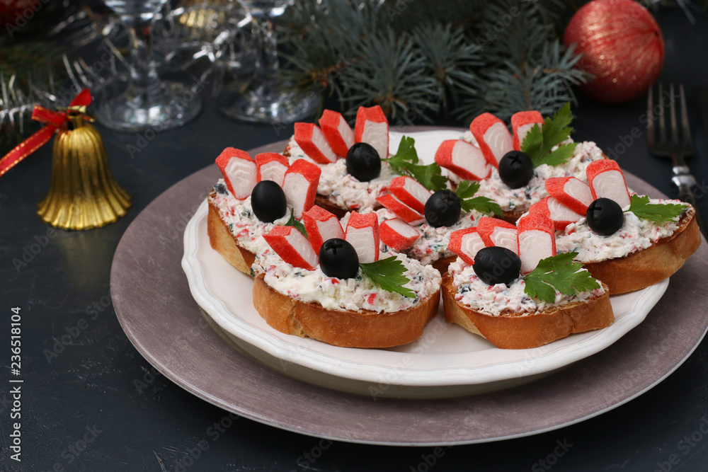 Festive sandwiches with crab sticks, feta cheese and black olives. Christmas background Festive sandwiches with crab sticks, feta cheese and black olives. Christmas background