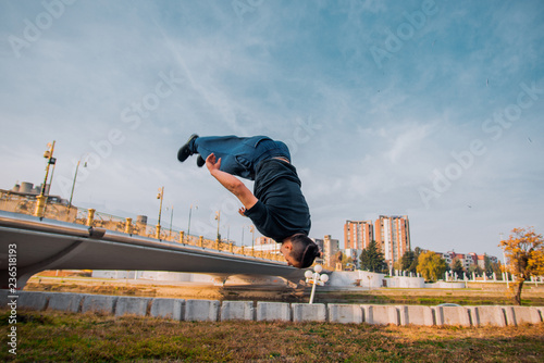 Wallpaper Mural Parkour man making salto backwards at urban place Torontodigital.ca