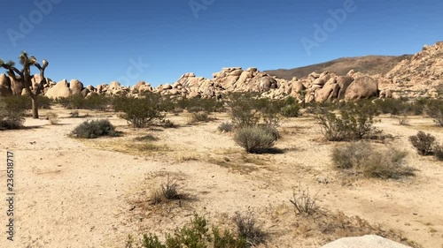 Slow panorama of Joshua Tree National Park, California.  Desert landscape and rock formations are a recreational destination photo