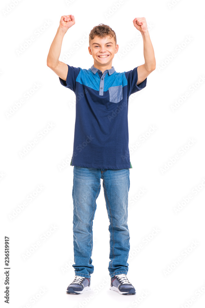 Full length portrait of young caucasian teen boy isolated on white background. Victory screaming funny teenager. Handsome winner child with his hands up looking at camera. Full length portrait of young caucasian teen boy isolated on white background. Victory screaming funny teenager. Handsome winner child with his hands up looking at camera.