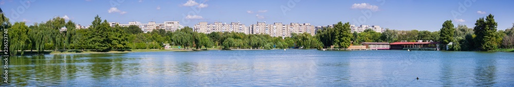 Lake in Tineretului Park surrounded by residential buildings, near downtown Bucharest, Romania