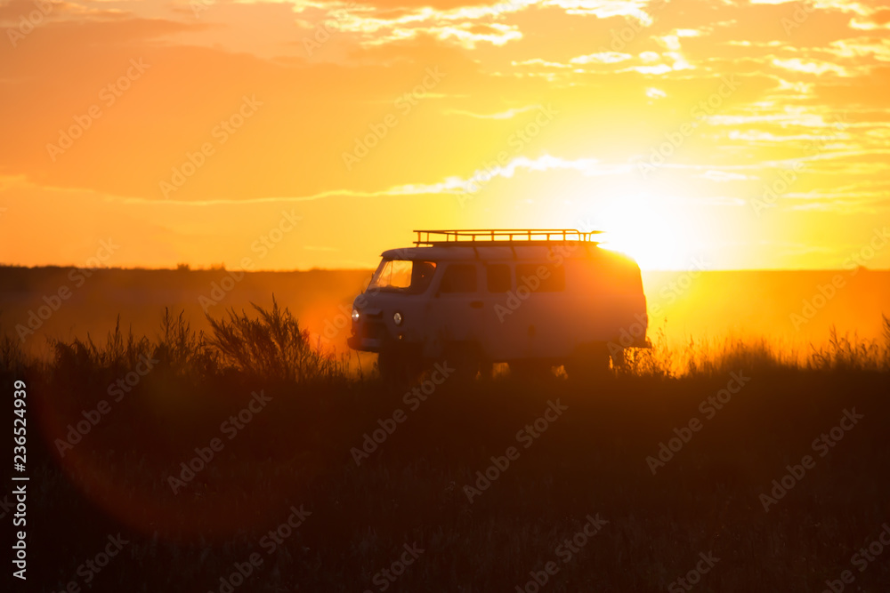 Fototapeta premium minivan is driving along a country road