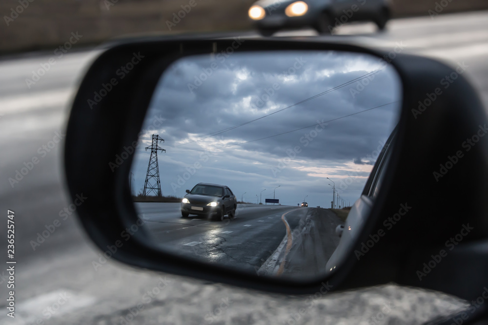 View in the side mirror of the car