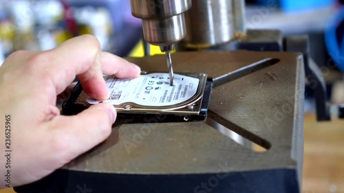 Destroying a hard drive with a drill press photo