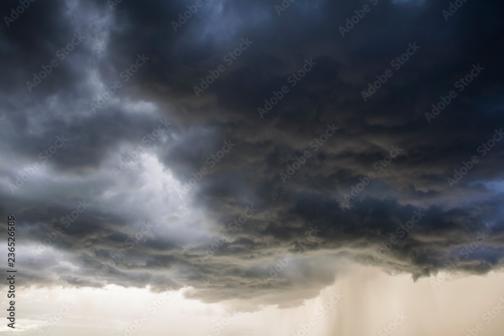 Obraz premium Light in the Dark and Dramatic Storm Clouds background