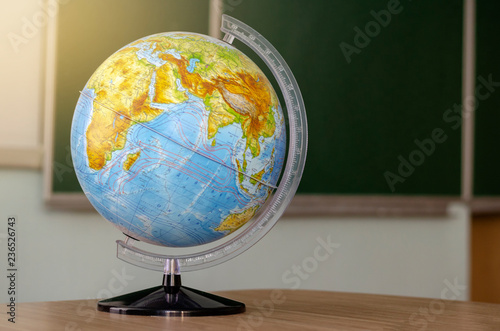 Kyiv, Ukraine - MAY 31, 2018: reduced model of the Earth. globe. Globe on the school desk