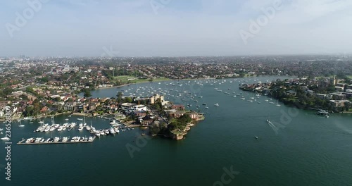 Gladesville bridge on Parramatta river in Sydney west over surrounding local residential suburbs with river boat traffic and rivercat ferries. photo