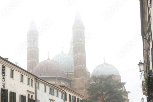 Church of St. Antonio in the city of Padova, Italy. Heavy fog in the city of Padova. Padua. Side view of the Basilica of St Anthony, iconic landmark and sightseeing in Padua, Italy. travel to Italy photo