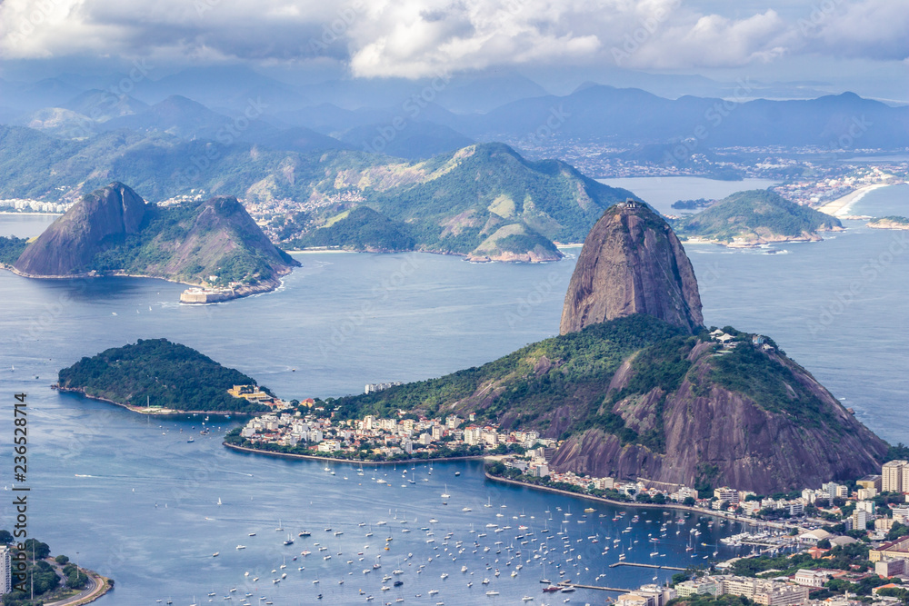Views from Christ The Redeem mountain over Sugar Loaf, Rio do Janeiro city, suburbs and favelas, amazing views over the bays, islands, beach and the city skyline from the top on a cloudy day, Brazil
Views from Christ The Redeem mountain over Sugar Loaf, Rio do Janeiro city, suburbs and favelas, amazing views over the bays, islands, beach and the city skyline from the top on a cloudy day, Brazil