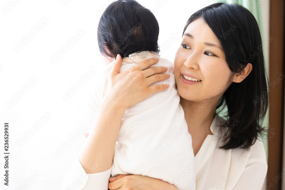 portrait of young asian mother and baby relaxing in living room portrait of young asian mother and baby relaxing in living room