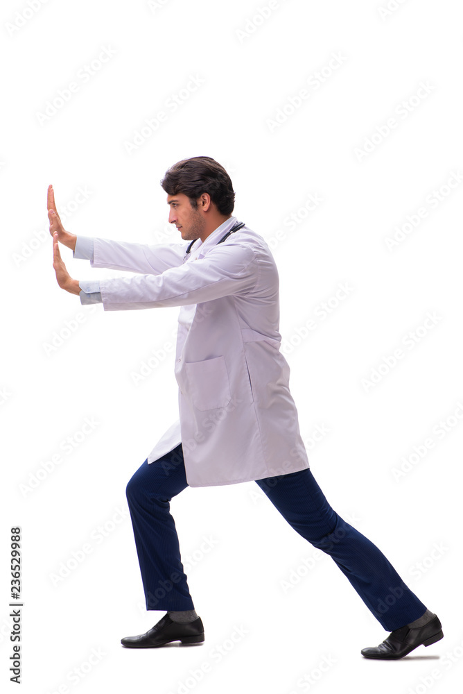 Young handsome doctor under pressure isolated on white Young handsome doctor under pressure isolated on white