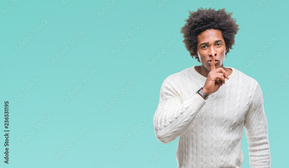 Afro american man over isolated background asking to be quiet with finger on lips. Silence and secret concept. Afro american man over isolated background asking to be quiet with finger on lips. Silence and secret concept.