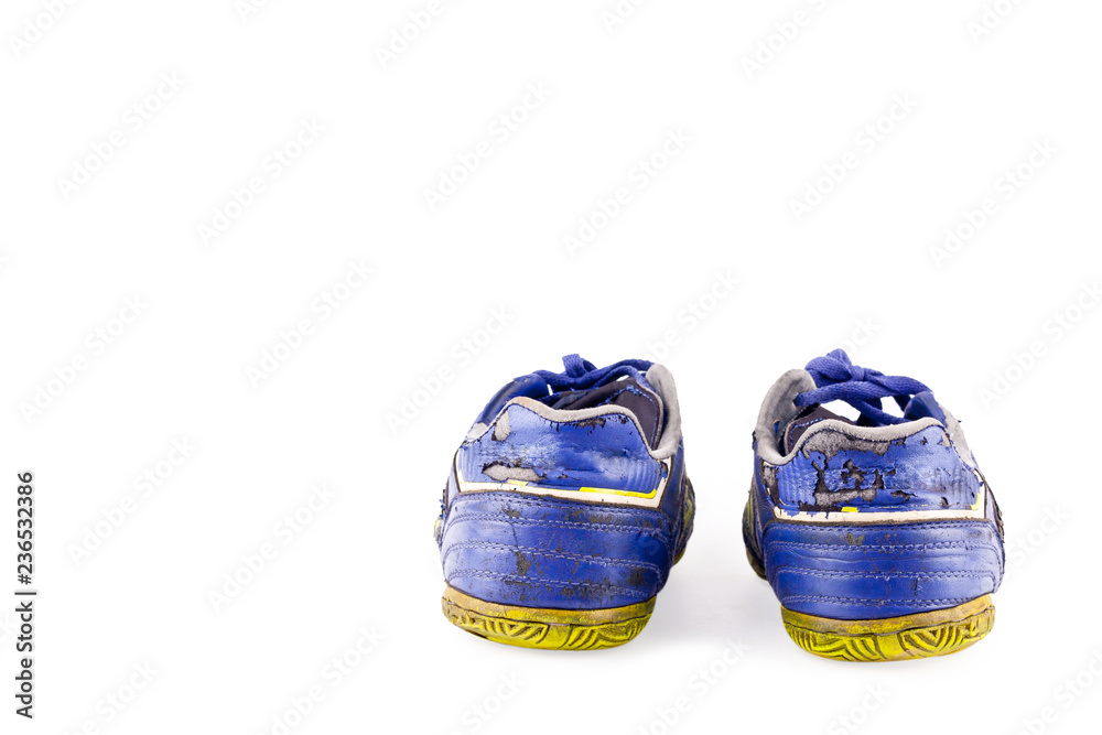 old vintage damaged futsal sports shoes on white background football sportware object isolated