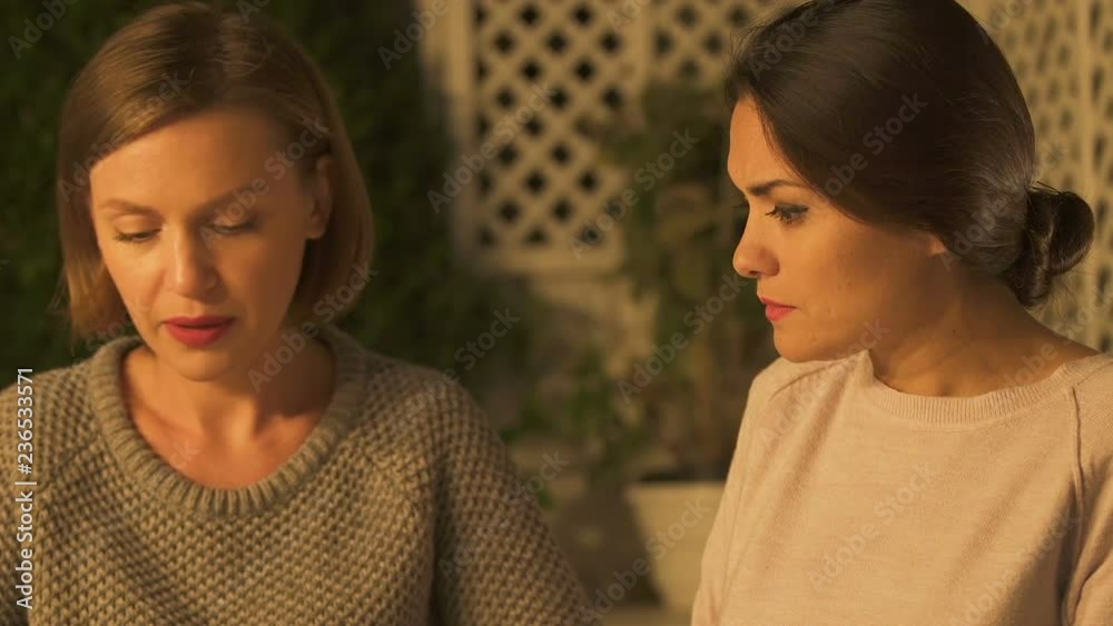 Upset woman telling bad news to friend, complaining of illness or loss, closeup Upset woman telling bad news to friend, complaining of illness or loss, closeup