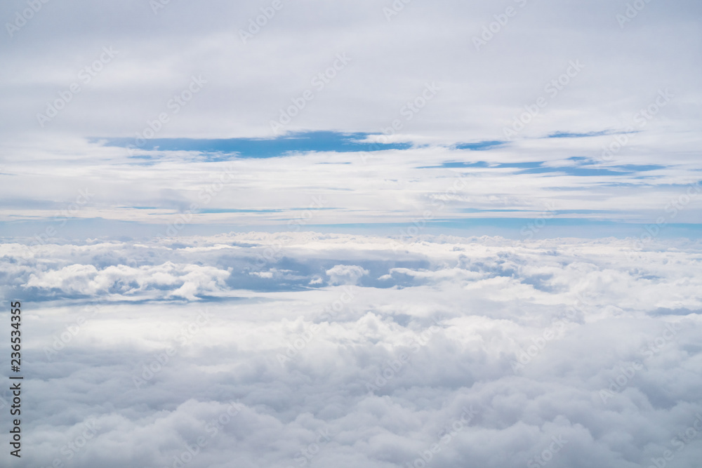 White fluffy clouds as seen from the airplane