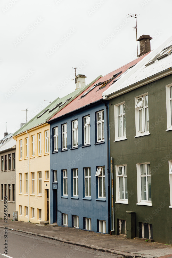 Blue, green, and yellow Icelandic apartments Blue, green, and yellow Icelandic apartments