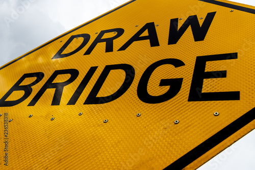 Abstract dirty dingy draw bridge sign close up