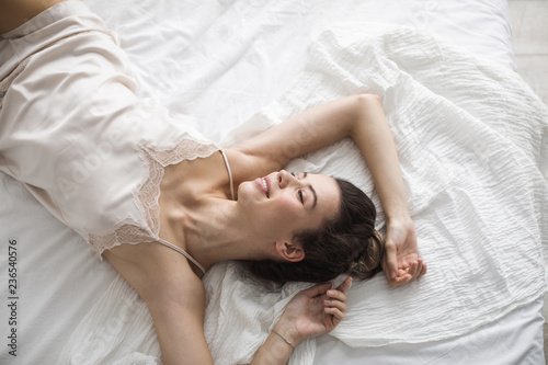 Woman Waking Up in Her Bed